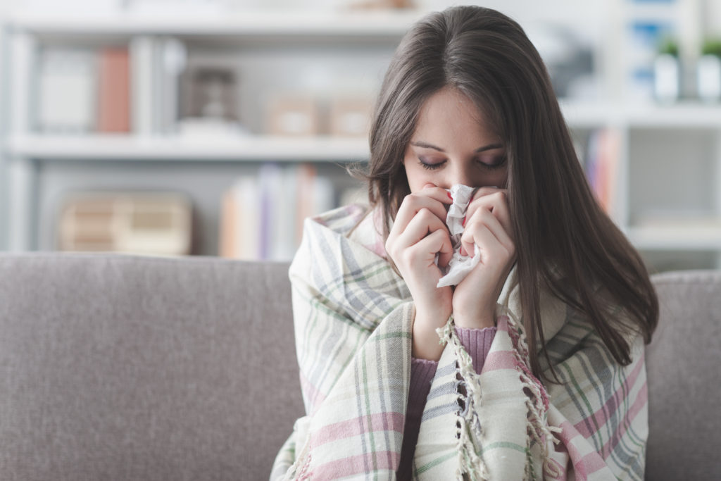 a woman experiencing allergies and depression